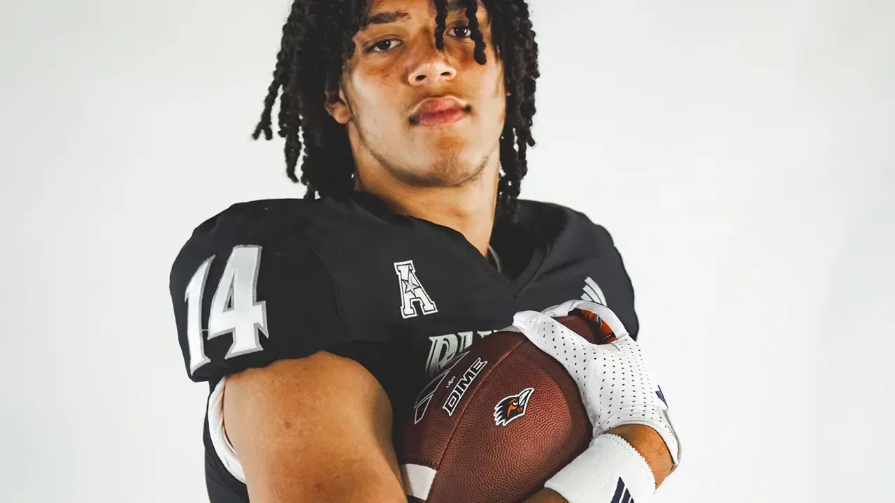 Isaiah Tanner in UTSA uniform holding football