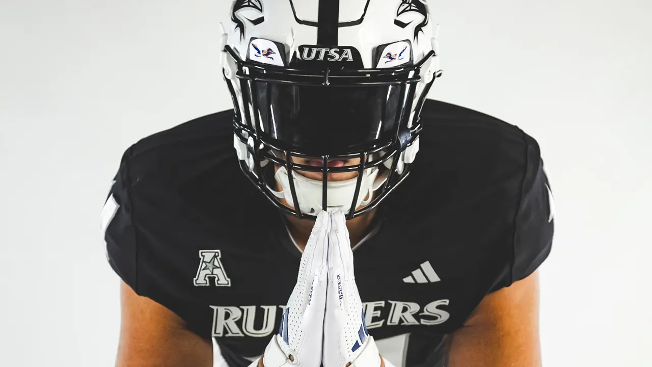 Isaiah Tanner wearing helmet with praying hands