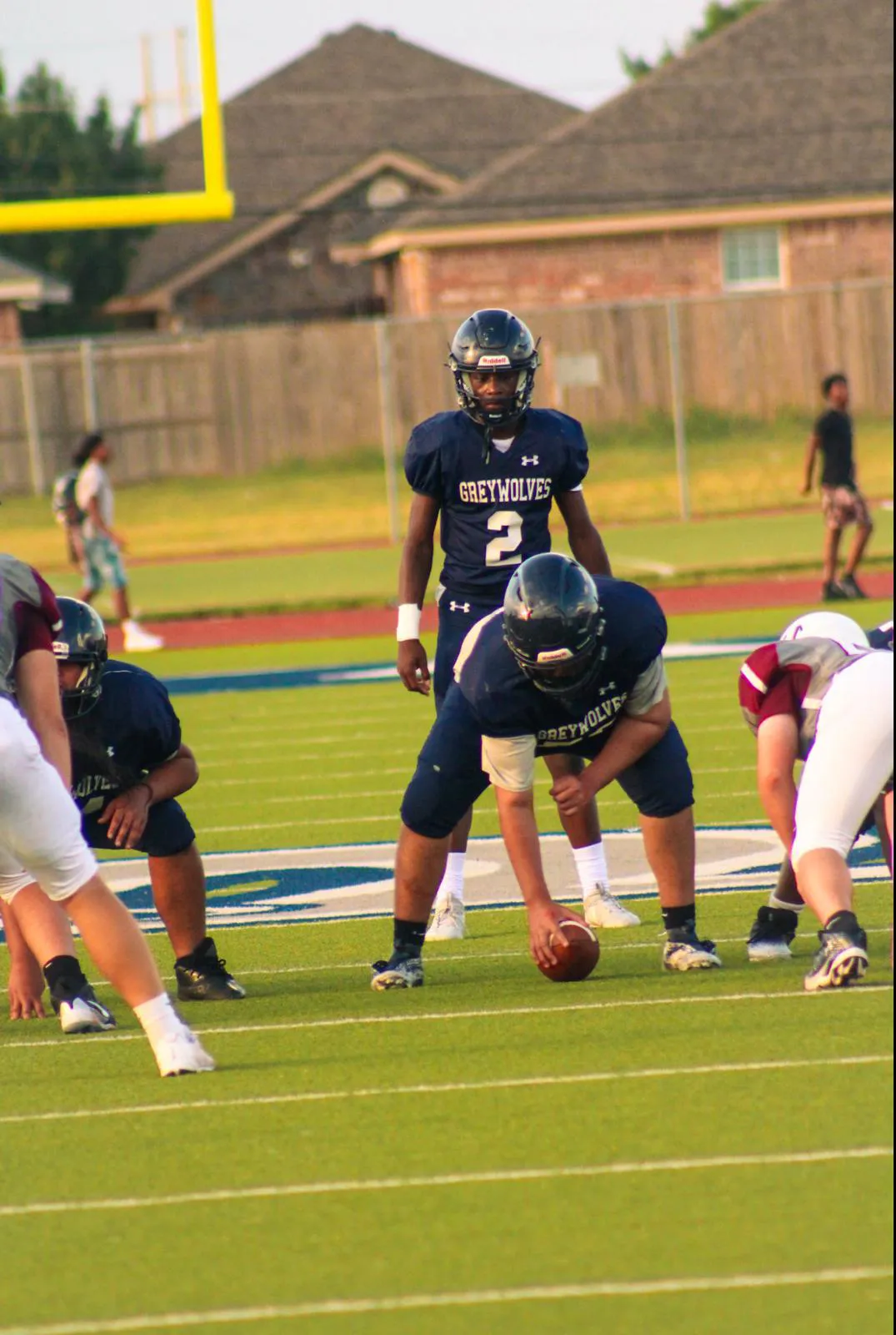 Major Curry 2526 season, behind center, about to take a snap