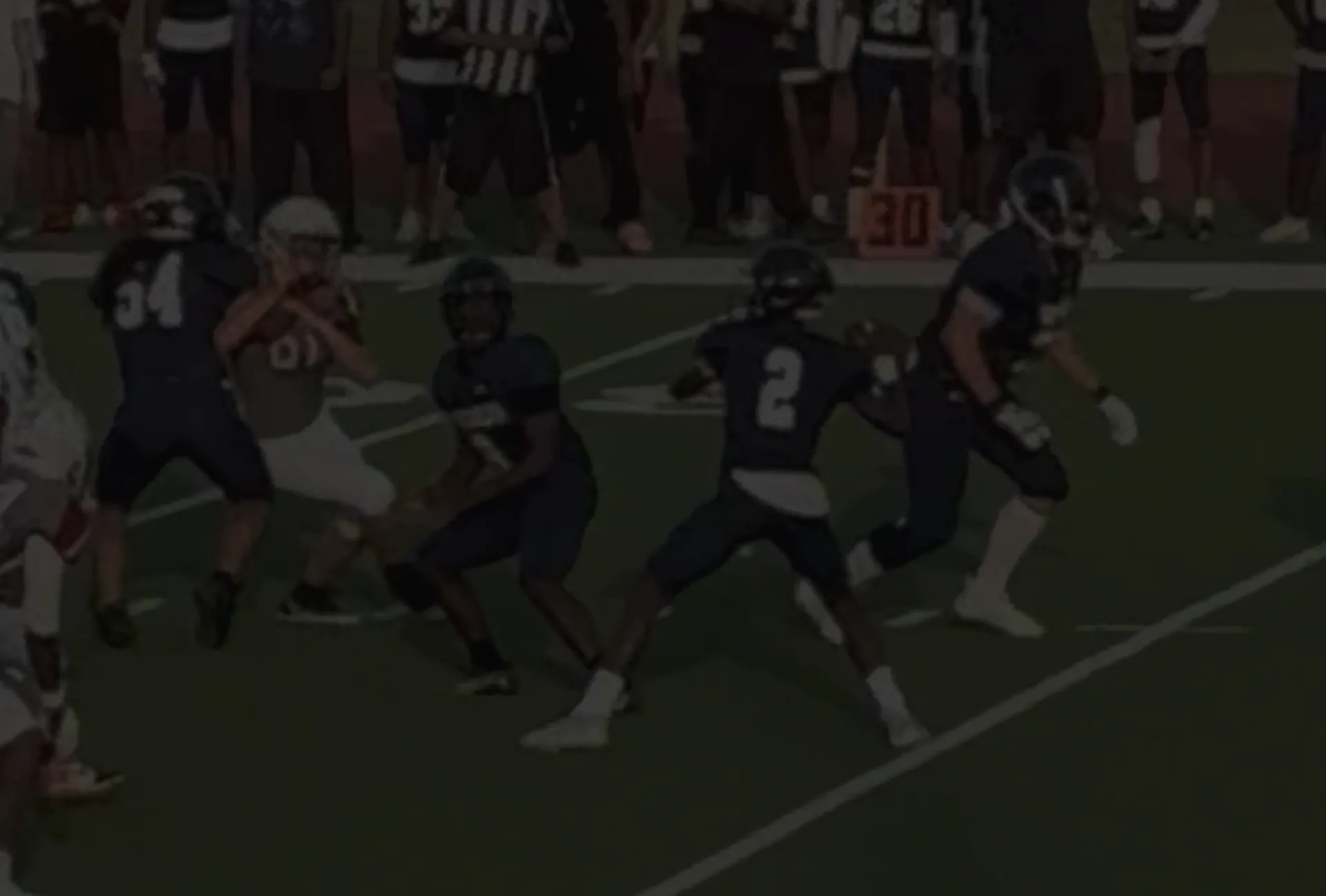 Subdued image of Major Curry about to make a throw in his 2526 season week 1 debut